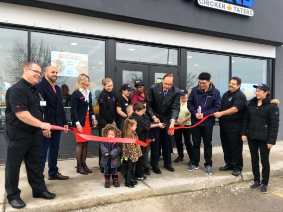 People celebrating the opening of a franchise branch