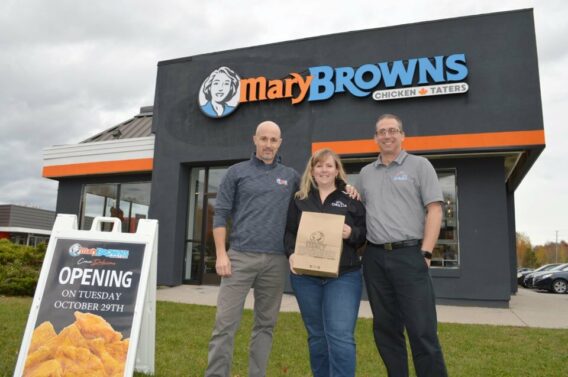 New franchise owners standing in front of their Mary browns location